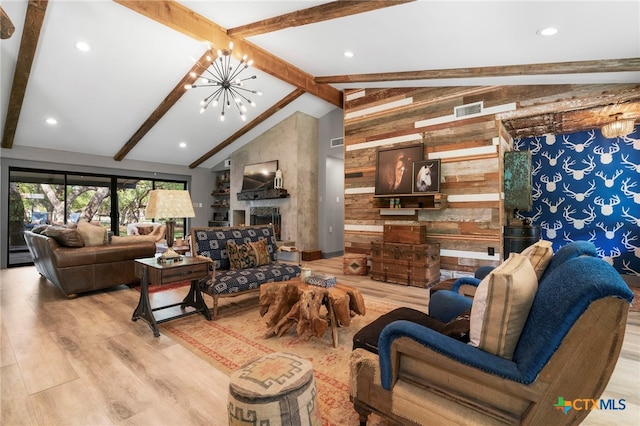 1910 S Rainbow Ranch Rd, Wimberley, TX 78676 - living room featuring wood finished floors, a chandelier, wood walls, a large fireplace, and recessed lighting