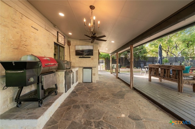 1910 S Rainbow Ranch Rd, Wimberley, TX 78676 - view of patio featuring fence, an outdoor kitchen, a ceiling fan, and grilling area