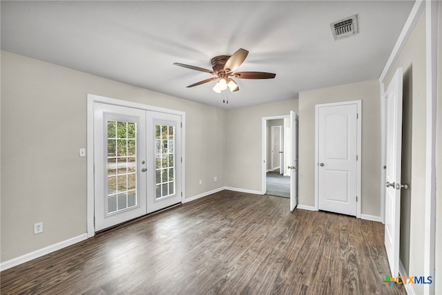 unfurnished room featuring dark wood-type flooring, french doors, and ceiling fan