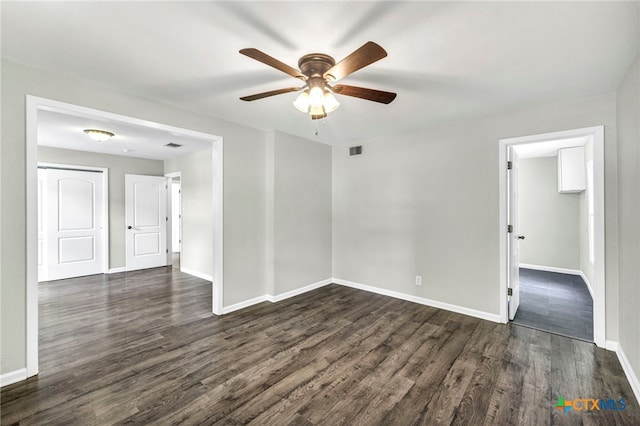 unfurnished room with dark hardwood / wood-style floors and ceiling fan