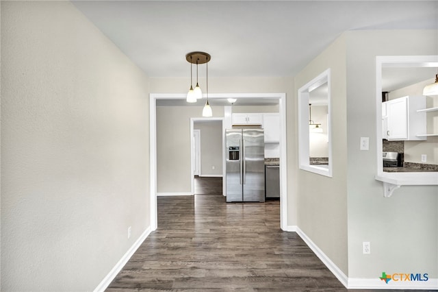 corridor featuring dark hardwood / wood-style flooring