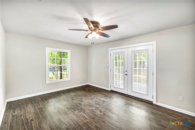 unfurnished room with ceiling fan, dark hardwood / wood-style floors, plenty of natural light, and french doors