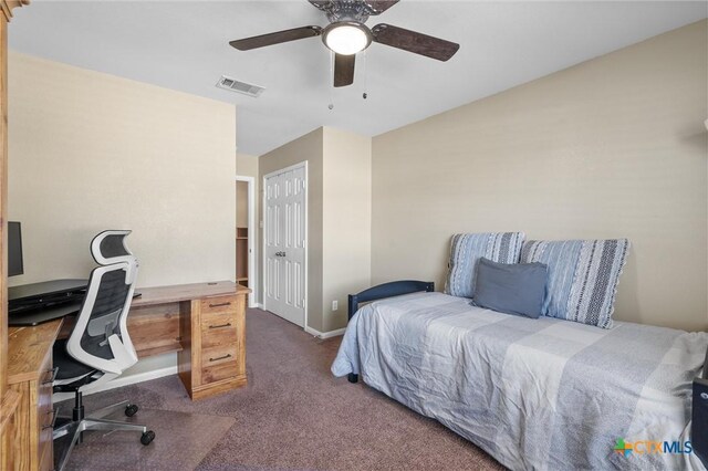 carpeted bedroom with visible vents, ceiling fan, and baseboards