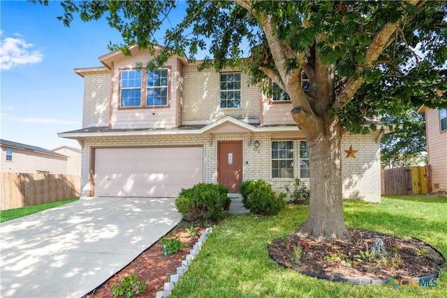 view of front of property featuring a garage and a front yard