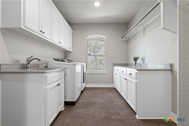1745 Alta Vista Loop, Temple, TX 76502 - washroom with a sink, cabinet space, washing machine and dryer, and baseboards