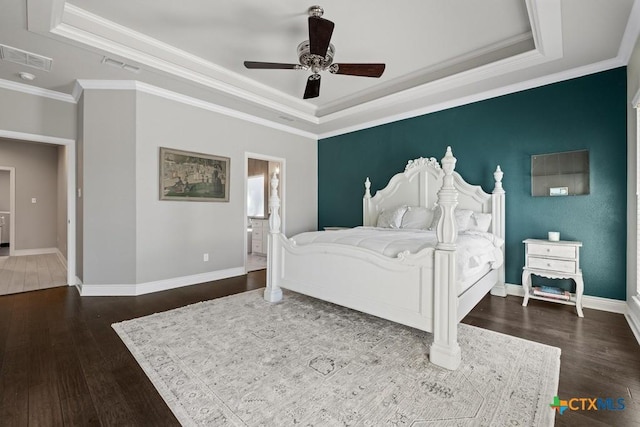 1745 Alta Vista Loop, Temple, TX 76502 - bedroom featuring a tray ceiling, crown molding, baseboards, dark wood-style floors, and visible vents