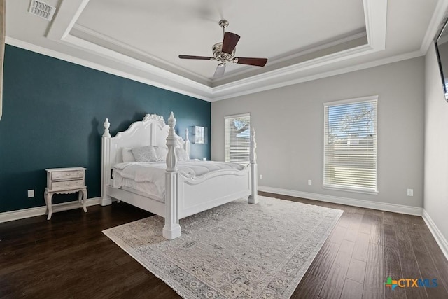 1745 Alta Vista Loop, Temple, TX 76502 - bedroom with dark wood finished floors, a tray ceiling, baseboards, and visible vents