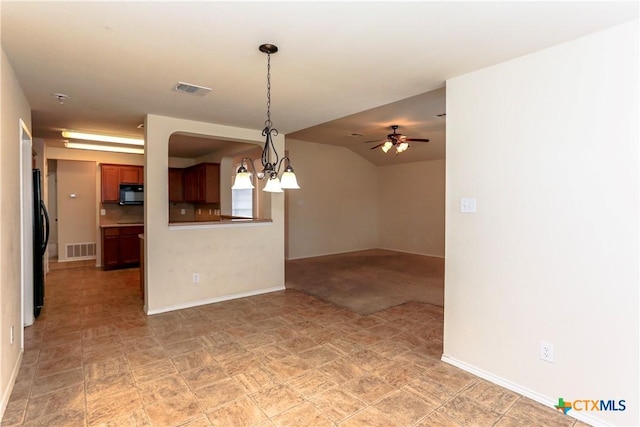 unfurnished living room featuring ceiling fan with notable chandelier, visible vents, and baseboards