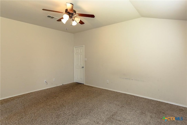 carpeted empty room with a ceiling fan, lofted ceiling, and visible vents