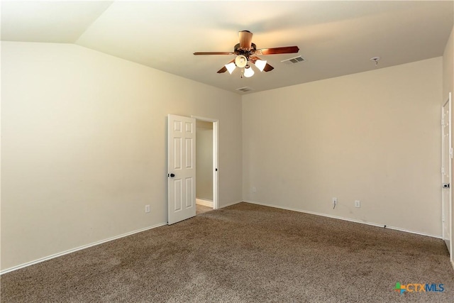 carpeted spare room featuring ceiling fan, lofted ceiling, visible vents, and baseboards