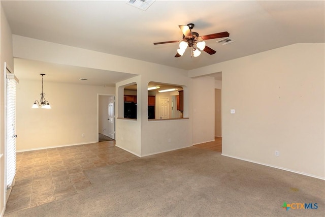 unfurnished room featuring light colored carpet, visible vents, baseboards, and ceiling fan with notable chandelier