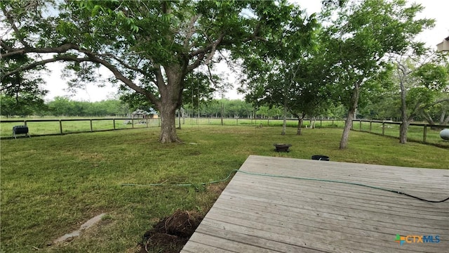 exterior space with a rural view and a wooden deck