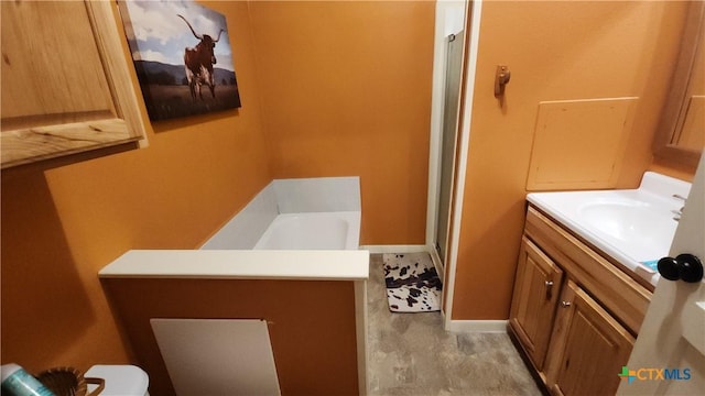 bathroom with vanity and a bathing tub