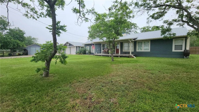 view of yard with a deck and a garage