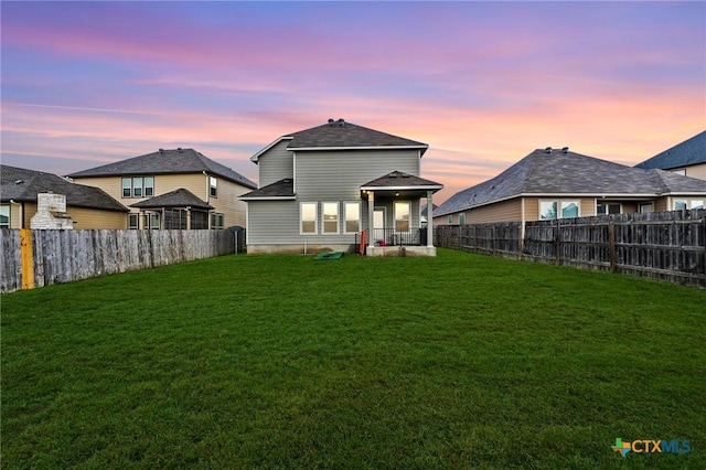 8209 Northgate Loop, Temple, TX 76502 - back of house at dusk featuring a fenced backyard