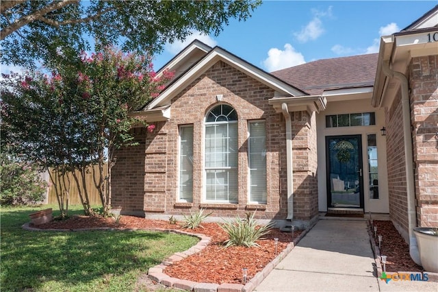 101 Arabian Dr, Victoria, TX 77904 - entrance to property with brick siding and roof with shingles