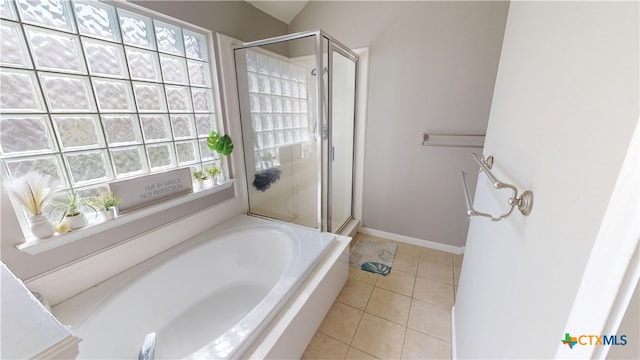 101 Arabian Dr, Victoria, TX 77904 - full bath featuring a shower stall, a garden tub, and tile patterned floors