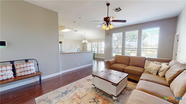 101 Arabian Dr, Victoria, TX 77904 - living room with a ceiling fan, a chandelier, and wood finished floors