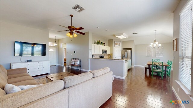 101 Arabian Dr, Victoria, TX 77904 - living room featuring a chandelier, healthy amount of natural light, dark wood-type flooring, and ceiling fan
