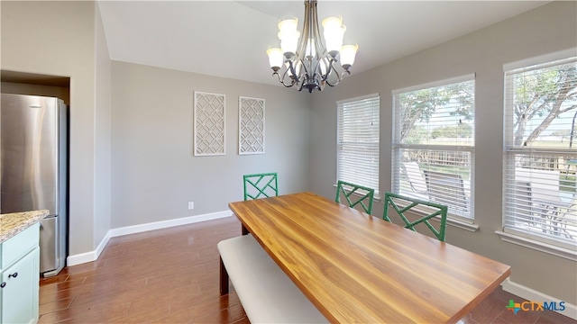 101 Arabian Dr, Victoria, TX 77904 - dining room with a chandelier and dark wood-style flooring