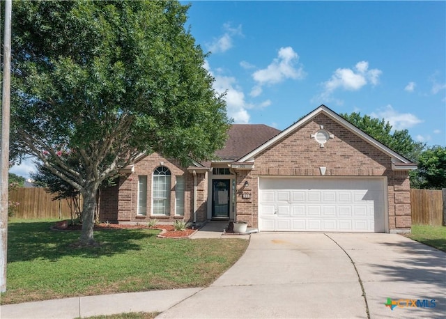 101 Arabian Dr, Victoria, TX 77904 - ranch-style house featuring brick siding, driveway, and a garage
