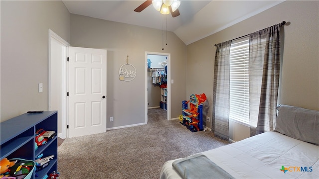 101 Arabian Dr, Victoria, TX 77904 - bedroom featuring vaulted ceiling, a walk in closet, carpet floors, and ceiling fan
