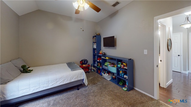 101 Arabian Dr, Victoria, TX 77904 - carpeted bedroom featuring lofted ceiling and ceiling fan