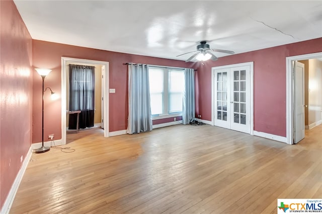 interior space with french doors, light hardwood / wood-style floors, and ceiling fan