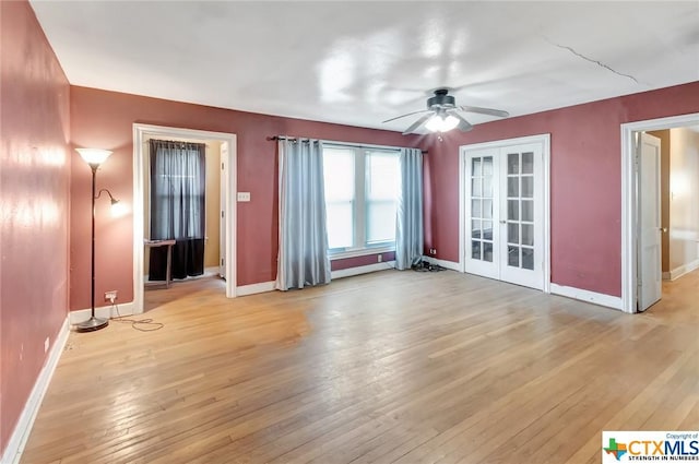 1005 Macarthur St, Victoria, TX 77901 - spare room with french doors, light wood finished floors, baseboards, and ceiling fan