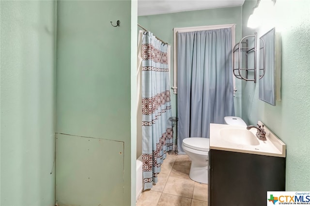 full bathroom with toilet, vanity, tile patterned floors, and shower / tub combo