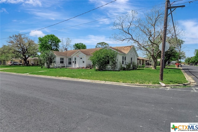 ranch-style house with a front yard