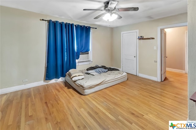 unfurnished bedroom featuring light hardwood / wood-style flooring and ceiling fan