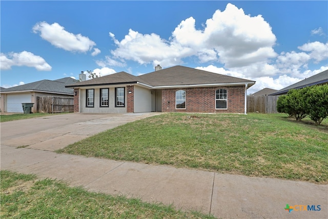 ranch-style house with a front yard and a garage