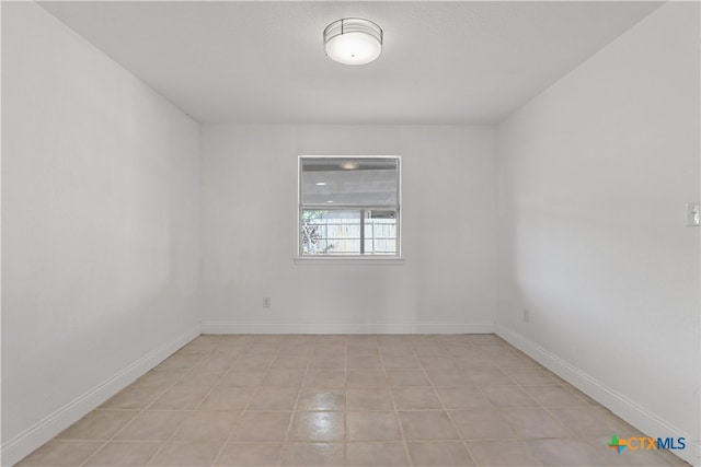 empty room featuring light tile patterned floors