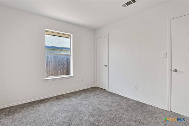 unfurnished room featuring carpet floors