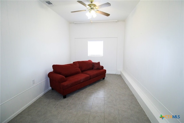 sitting room with ceiling fan and light tile patterned floors