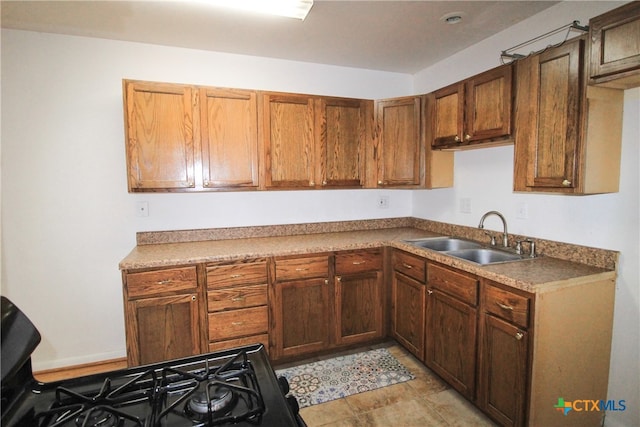 kitchen featuring sink and light tile patterned floors