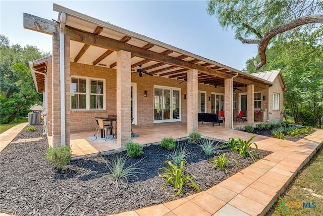 352 Ridge Crest Dr, Seguin, TX 78155 - rear view of house with a ceiling fan, central AC, a patio, and brick siding