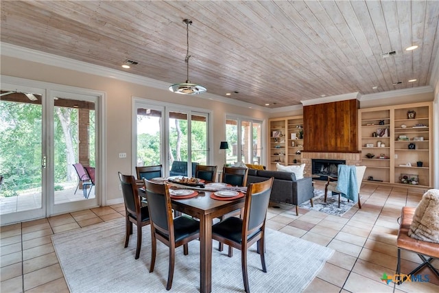 352 Ridge Crest Dr, Seguin, TX 78155 - dining space with light tile patterned floors, wooden ceiling, a brick fireplace, ornamental molding, and recessed lighting