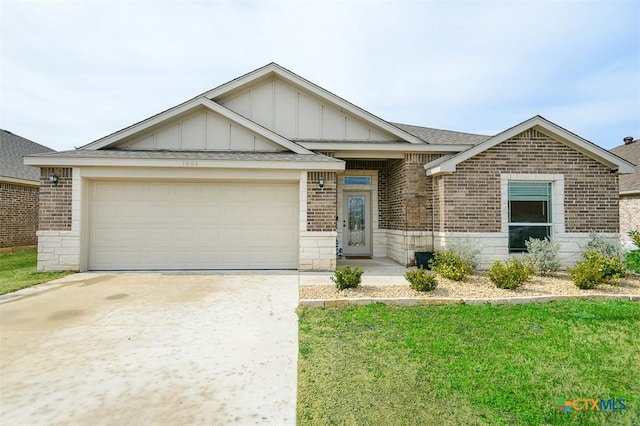 view of front of house with a garage and a front yard