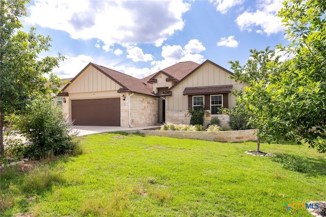 view of front of home featuring a garage and a front yard