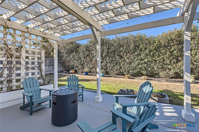 view of patio / terrace featuring fence and a pergola