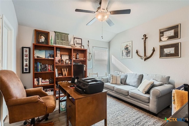 office featuring lofted ceiling, wood finished floors, and ceiling fan