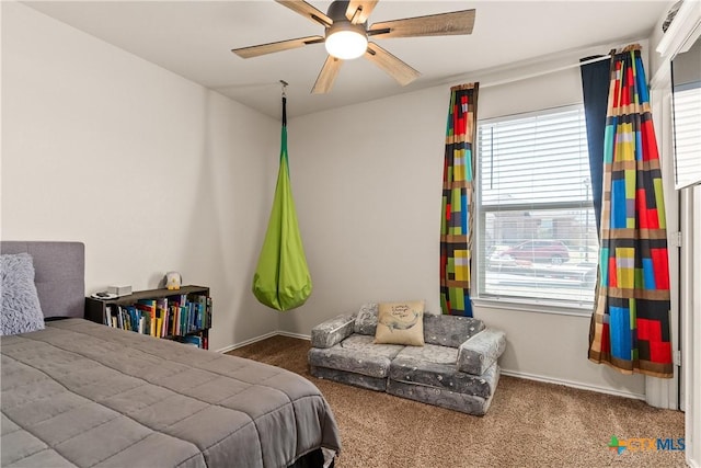 bedroom featuring ceiling fan, baseboards, and carpet floors