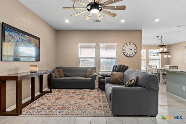 tiled living room with recessed lighting, a ceiling fan, visible vents, and baseboards