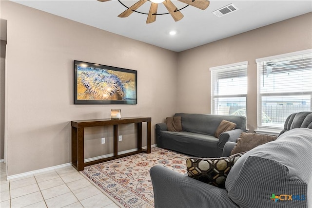 living area featuring light tile patterned floors, baseboards, visible vents, recessed lighting, and ceiling fan