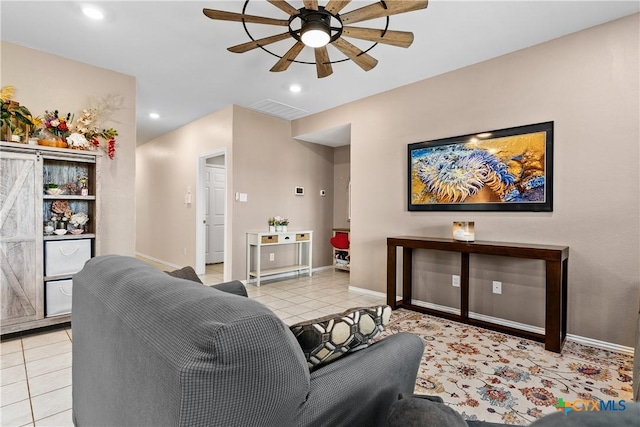 living room with a ceiling fan, visible vents, baseboards, light tile patterned flooring, and recessed lighting