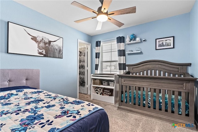 carpeted bedroom featuring ceiling fan