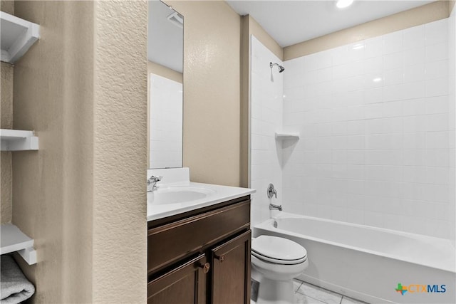 full bathroom with tile patterned flooring, toilet, bathtub / shower combination, a textured wall, and vanity