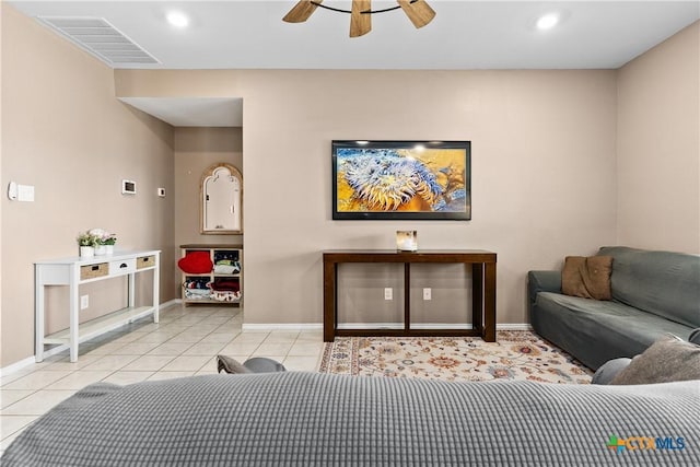 living area with tile patterned floors, visible vents, a ceiling fan, recessed lighting, and baseboards